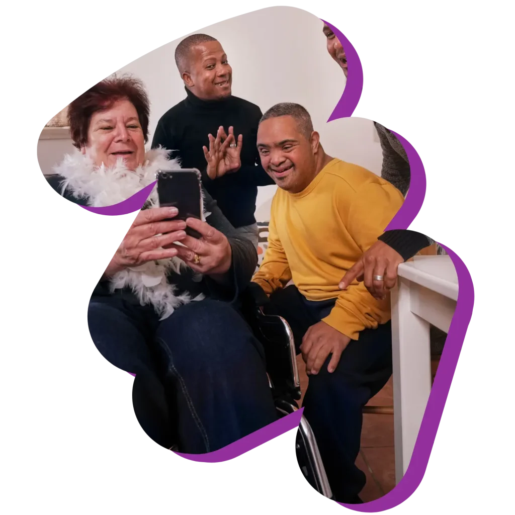 Group of disabled friends looking at mobile phone