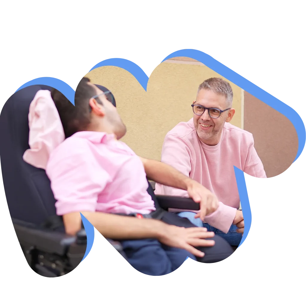 Support worker smiling with disabled man